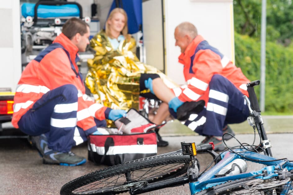 Accident bike woman get emergency help paramedics - Attorneys.Media - Legal Expert Interviews & Trusted Advice
